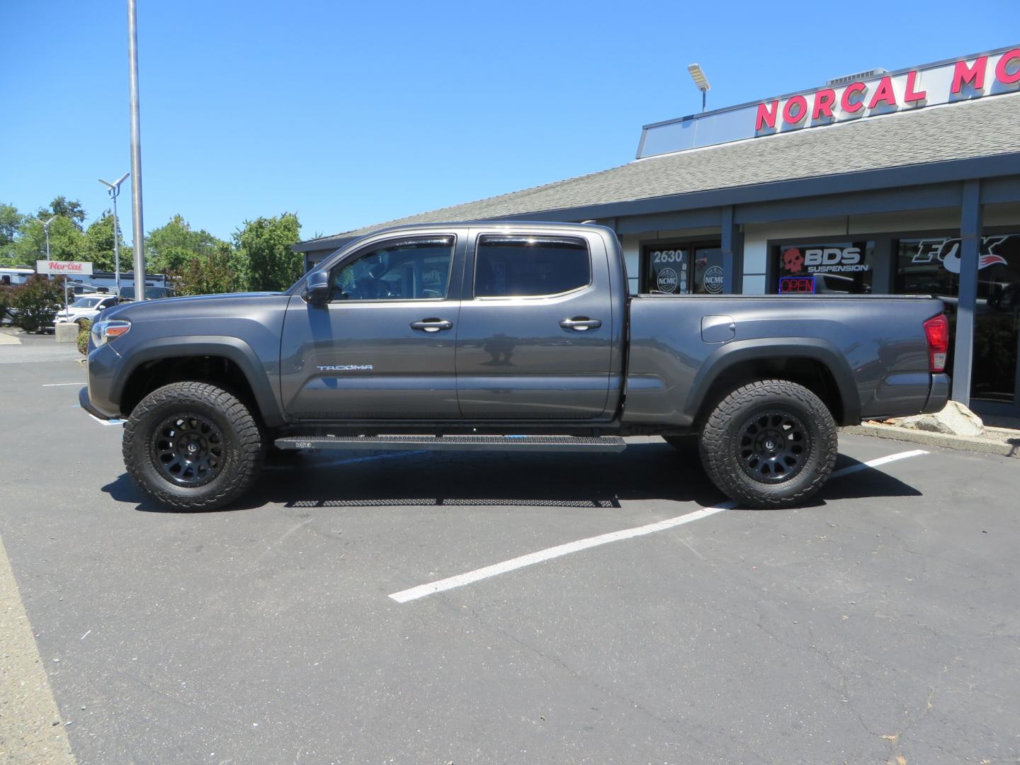 2017 CHARCOAL /GREY Toyota Tacoma TRD OFF-ROAD Double Cab Long Bed V6 6AT 4WD (3TMDZ5BN3HM) with an 3.5L V6 engine, automatic transmission, located at 2630 Grass Valley Highway, Auburn, CA, 95603, (530) 508-5100, 38.937893, -121.095482 - TRD Off-road Tacoma with a level kit, 17" Fuel Vector wheels, Falken Wildpeak AT tires, N-Fab running boards, Roll Up tonneau cover, BedRug, and window Deflectors. - Photo#7